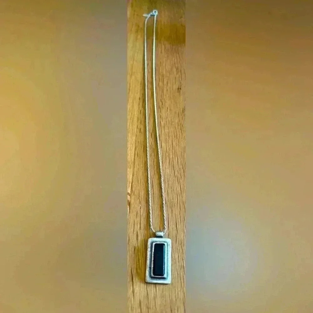 NY & CO vintage silver tone necklace and rectangular pendant with black stone.